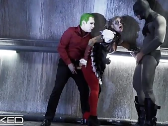 Harley Quinn gets ferociously double-teamed by Joker & Batman in Unholy costume play sequence
